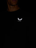 Man wearing black crew neck sweatshirt with white wing logo on chest