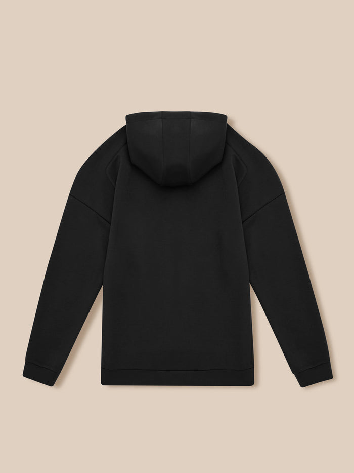 Back view of black travel zip hoodie with attached hood and clean straight silhouette