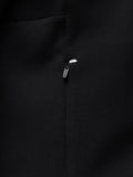 Close-up of black Travel Zip Hoodie chest area with visible zipper pull and Castore branding.