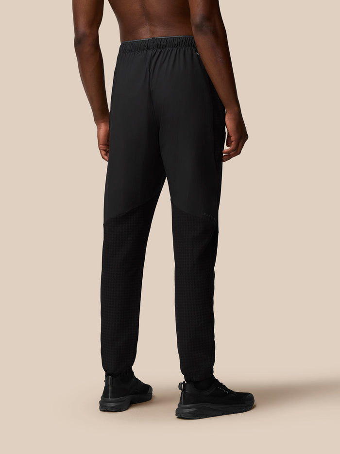 Back view of black Flex Winterised Woven Joggers with textured lower leg panels.
