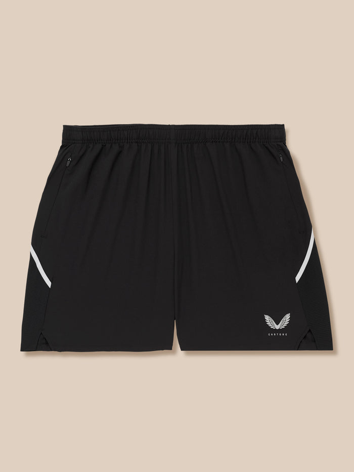 Waistband area of black Apex shorts showing zip pocket and white side panel with Castore logo