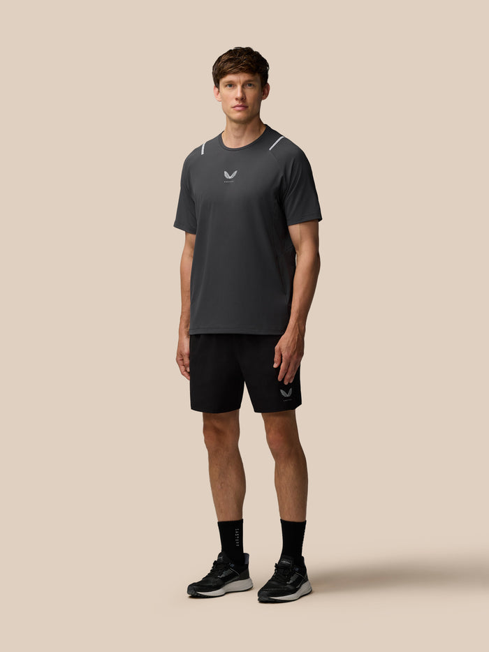 Male model wearing black Apex 6 inch shorts with Castore logo on the left leg.