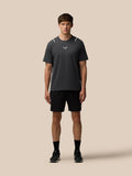 Front view of a man wearing Gunmetal/Silver Reflective Apex Training T-Shirt with reflective shoulder accents.