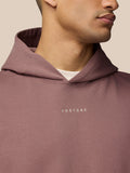 Close-up of mauve Adapt Lifestyle Hoodie neckline showing the hood and Castore logo on the chest.