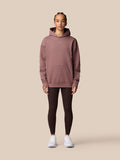Model wearing Adapt Lifestyle Hoodie Mauve with front pocket and relaxed fit, full body view.