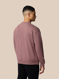 Back view of mauve Adapt Lifestyle Sweatshirt on model with relaxed silhouette and ribbed cuffs and hem.