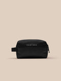 Active Wash Bag in black with Castore branding on the front pocket, front view.