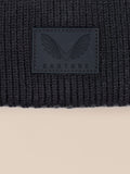 Close up of ribbed knit fabric with Castore logo patch on the beanie cuff