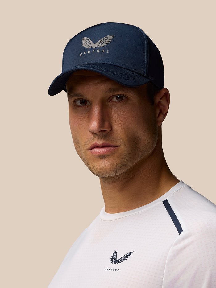 Unisex navy Castore cap made from 100% nylon with halo eyelets and adjustable back strap