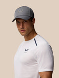 Model wearing charcoal Active Cap with halo eyelets and adjustable back