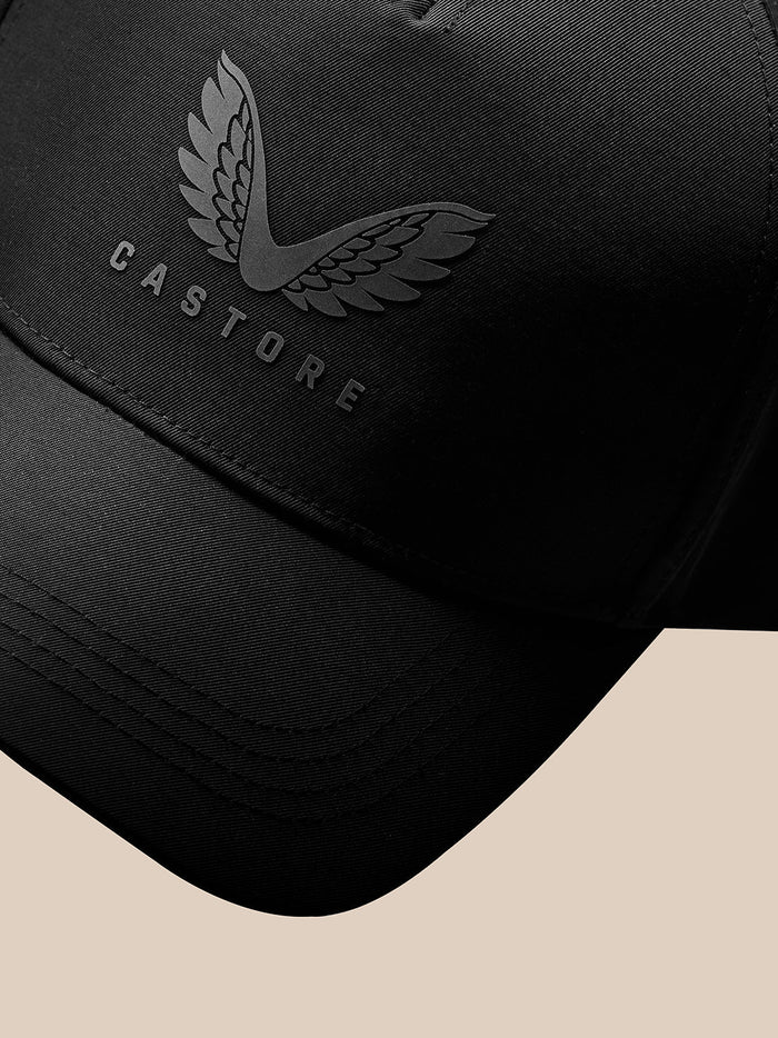 Close up of Castore wing logo and CASTORE text on black cap