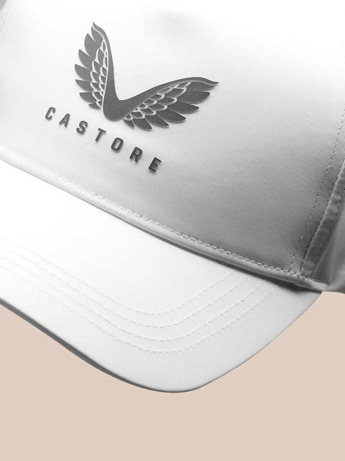 Close-up of white cap front panel showing Castore wing logo and branding
