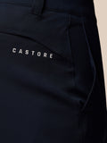 Close up of navy golf trousers back pocket showing Castore branding.