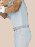 Close up of light grey golf shorts showing waistband with belt loops and a woven belt