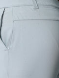 Close up of light grey golf shorts with ProTek label and water droplets on the fabric