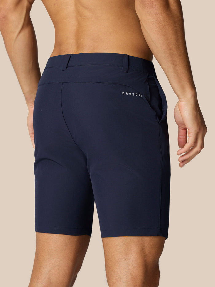 Back view of navy golf shorts showing Castore logo on right hip