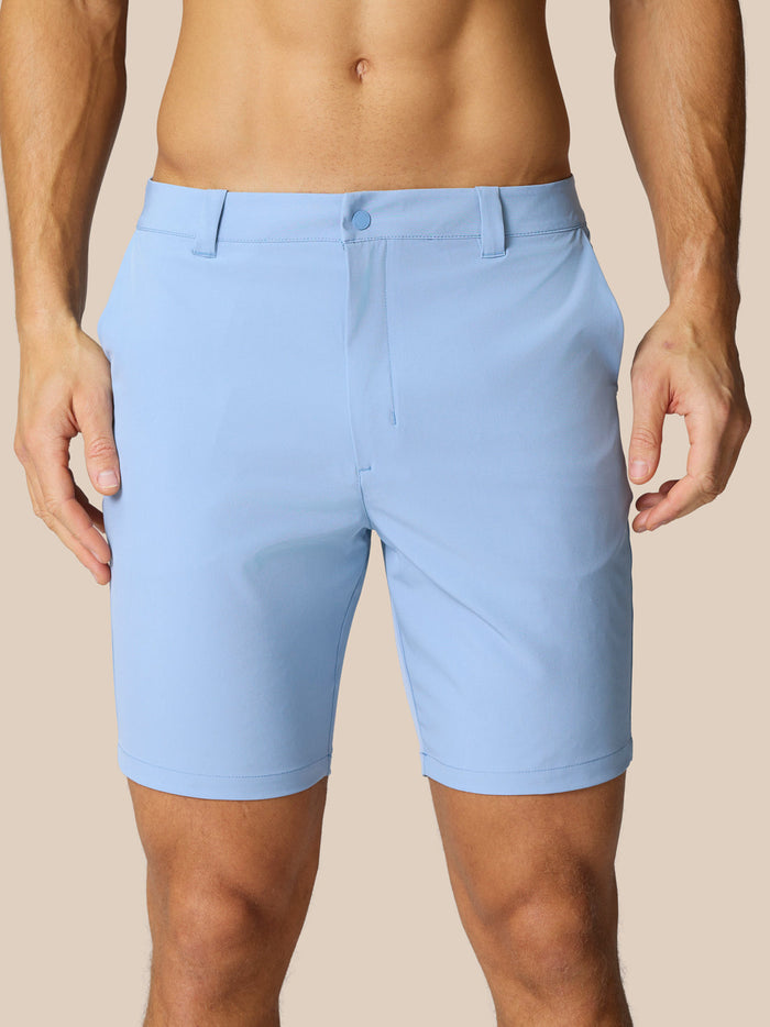 Light blue Golf Club shorts shown from back with belt loops and Castore branding on the right rear.