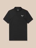 Close-up of the black Pinnacle Pique Stripe Polo fabric with subtle stripes and the Castore chest logo
