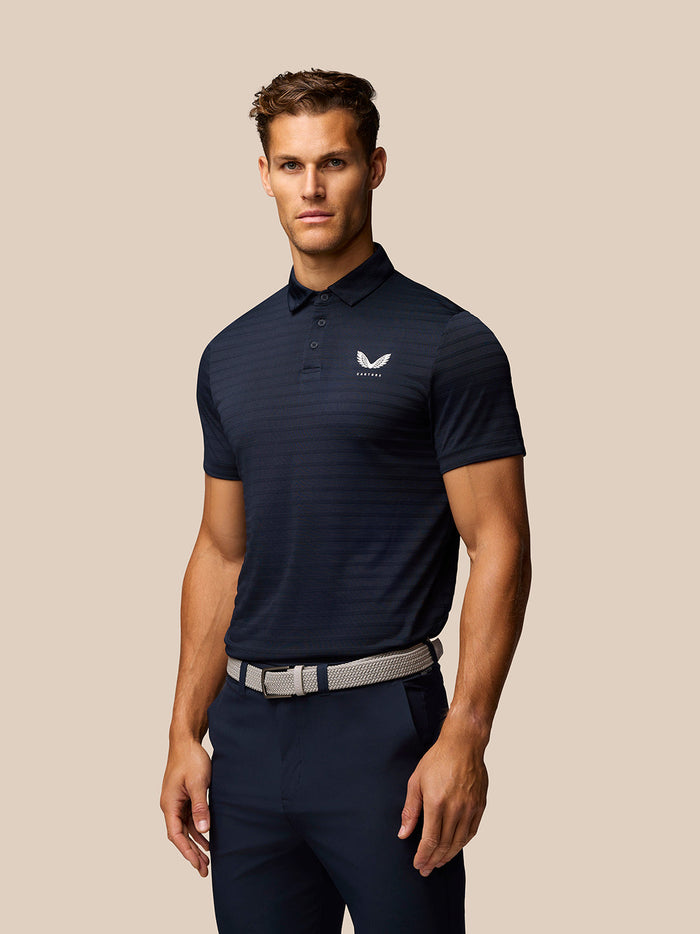 Navy Pinnacle Pique Stripe golf polo with stripe texture, three button collar and Castore logo on left chest.