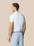 Back view of a man wearing a white Golf Pinnacle Polo with Castore branding along the upper back.