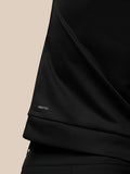 Close up of the sleeve cuff showing PROTEK branding on the black Golf Club Classic top.