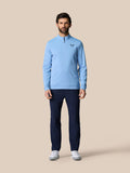 Male model wearing sky blue golf quarter zip top with stand collar and front zip