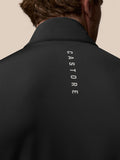 Back view of black golf gilet with vertical Castore branding along the upper back.
