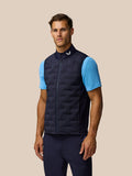Front view of male model wearing navy Pinnacle Lightweight Hybrid Gilet with full zipper and Castore branding at the collar