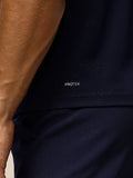 Close up of navy Pinnacle Gilet showing PROTEK branding on the back area