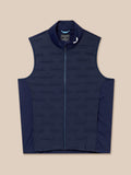 Flat lay of Golf Pinnacle Gilet in midnight navy showing sleeveless design and full front zip.