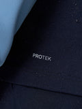 Protek branding on navy Pinnacle Gilet highlighting water resistant finish.