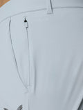 Close-up of back pocket area on light grey Golf Pinnacle trousers with ProTek branding and water droplets