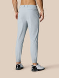 Back view of light grey Golf Pinnacle 32 trousers showing logo near hip and zip cuffs