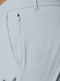 Side view of light grey golf trouser leg with ankle zip closure and cuff