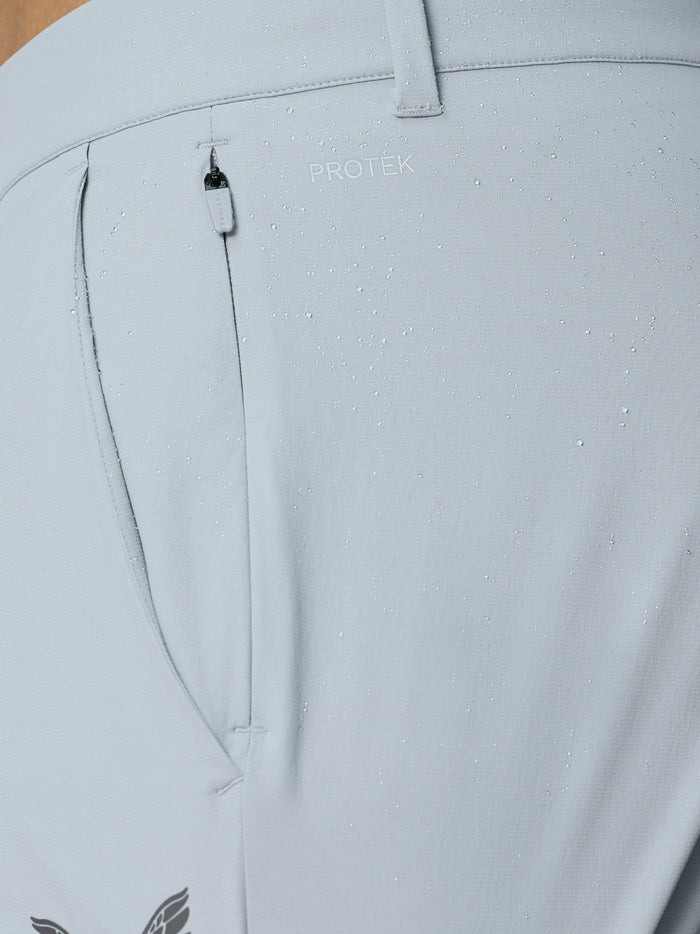 Side view of light grey golf trouser leg with ankle zip closure and cuff