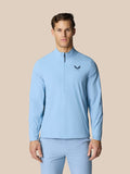 Male model in sky blue Flex jacket with high funnel neck and half zip; Castore logo on chest