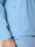 Close-up of side zipper on sky blue Flex Jacket with clean seam lines.
