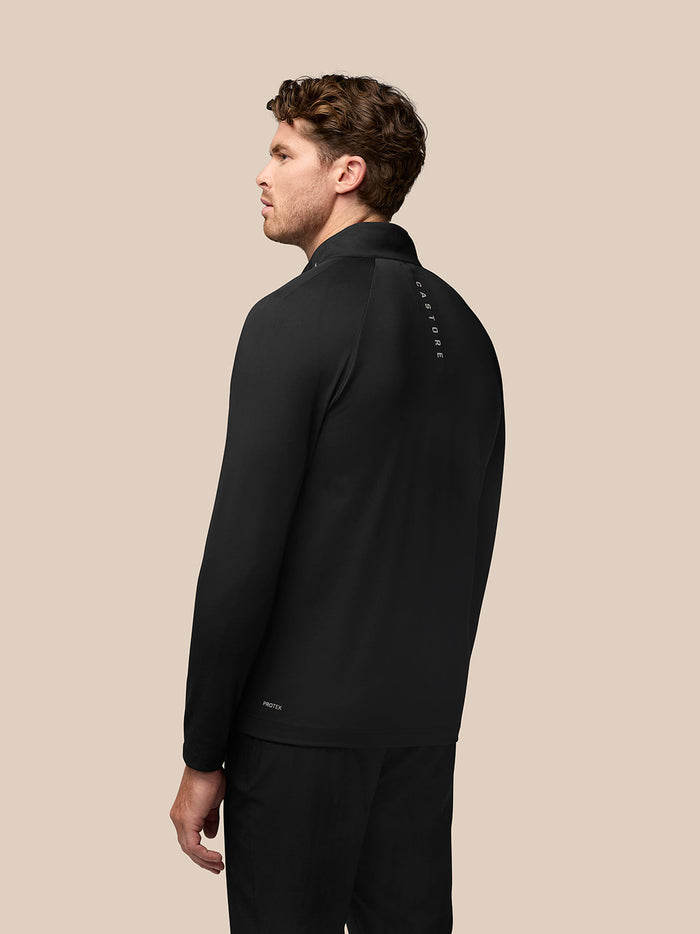 Back view of black Golf Pinnacle Jacket on model with Castore branding along the back.