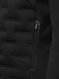 Close up of the Golf Pinnacle Jacket front showing the zipper and quilted panels