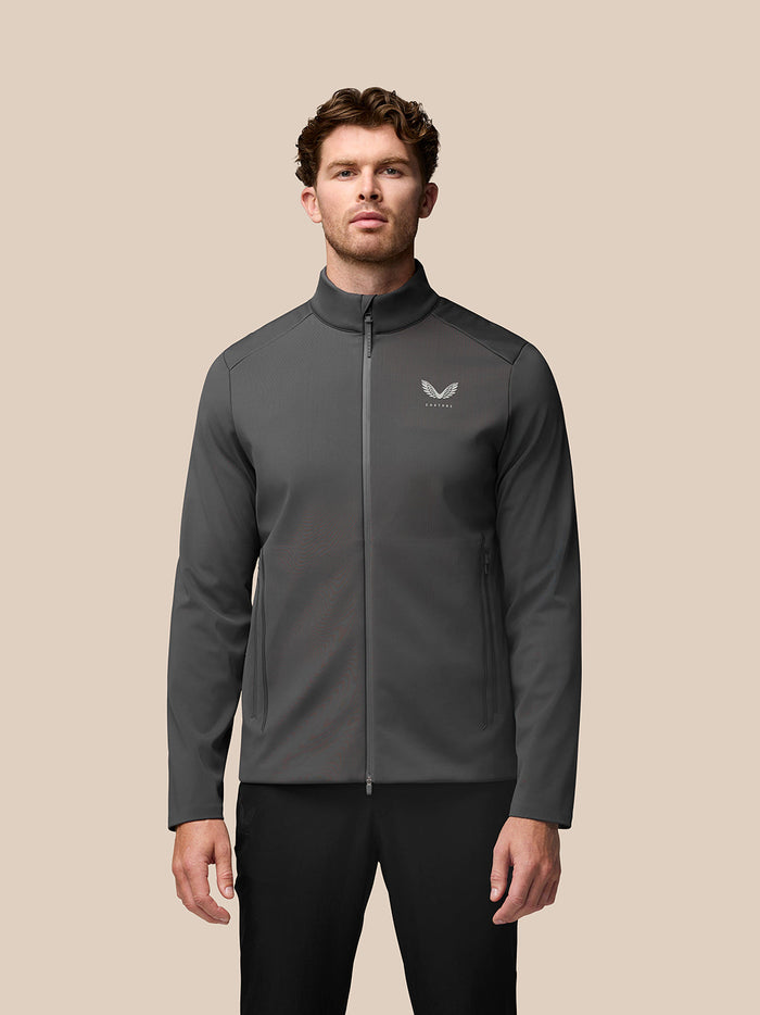 Charcoal Garcia Hybrid Jacket on model with stand collar and zip pockets.