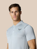 Close up of model in light grey Pinnacle Golf LVS Polo showing diagonal chest stripes and chest logo.