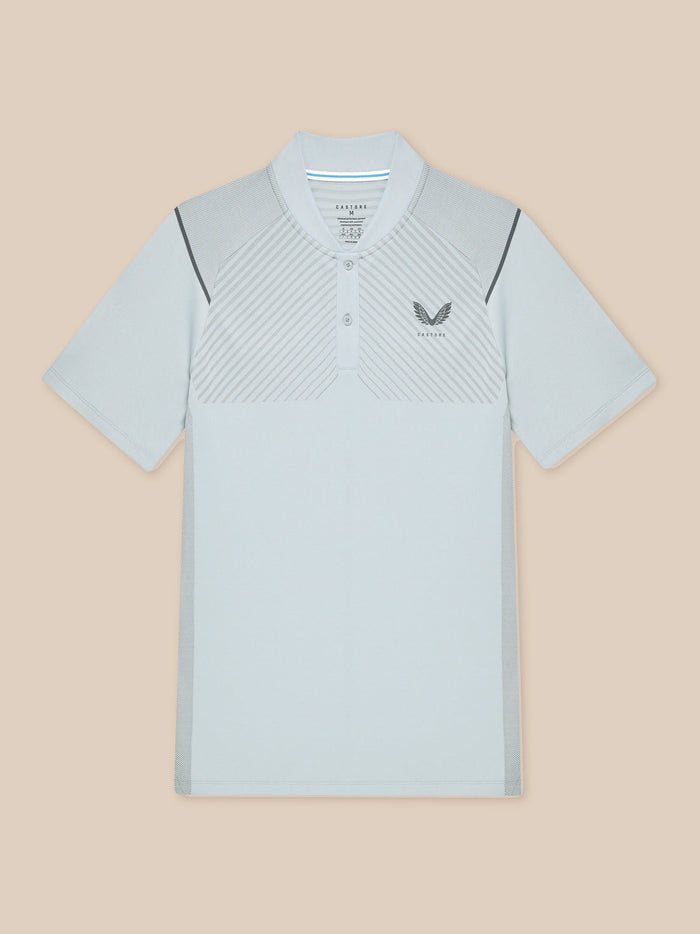 Flat lay of light grey Pinnacle Golf LVS Polo front showing diagonal chest stripes and logo.