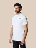 Front view of a man wearing a white golf ball print Club Graphic Polo with left chest logo.