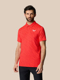 Front view of a man wearing Club Graphic Polo in Poppy Red with a polo collar and chest logo