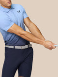 Model wearing Club Graphic Polo Sky Blue with an ombre gradient lower panel and Castore branding on the chest.
