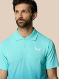 Front view of a man wearing a light aqua Club Graphic Polo with a three button placket and Castore logo on the left chest
