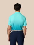 Back view of the light aqua Club Graphic Polo showing the ombre pattern and Castore branding on the upper back.
