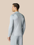 Back view of a man wearing the Pinnacle LVS 1/4 Zip Top in mid grey with ventilation stripes down the back.