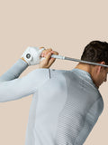 Golfer in mid grey Pinnacle LVS 1/4 Zip Top during a swing, showing the back striped ventilation panel.