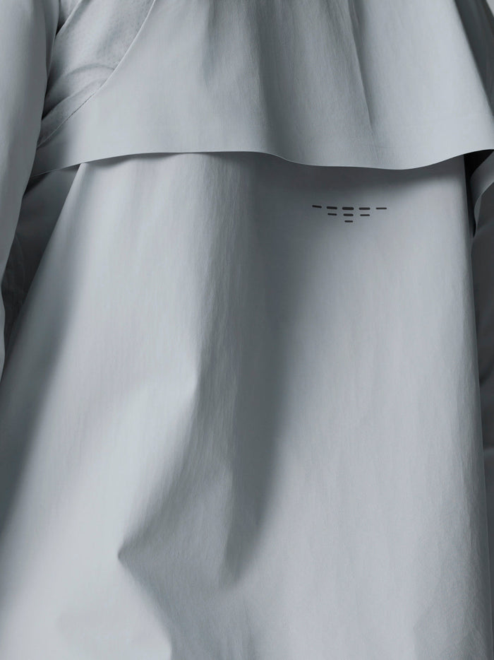 Golf Pinnacle LVS Woven Jacket back view in mid grey featuring vent panel and curved hem